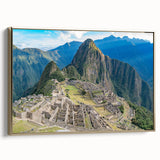 Framed canvas featuring a vintage-style landscape painting of Machu Picchu in muted gold and black tones.