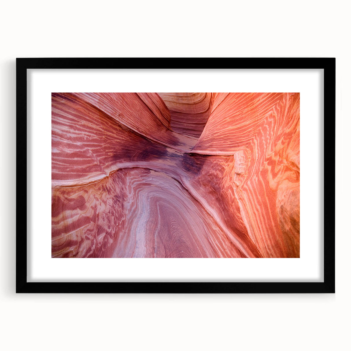 Abstract art print of Coyote Buttes in Arizona, featuring vibrant, textured colors on a large black-framed canvas.
