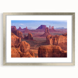 Textured art print of the Grand Canyon in earthy tones on a silver-framed mat, suitable for bedroom decor.