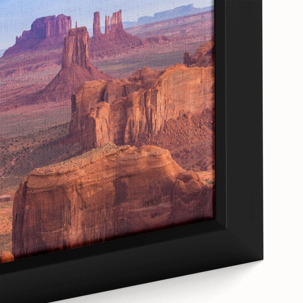 Extra large framed canvas of the Grand Canyon in black with vibrant, textured color accents, ideal for living room decor.