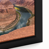 Framed canvas of Arizona's Horseshoe Bend in textured black tones with colorful accents.