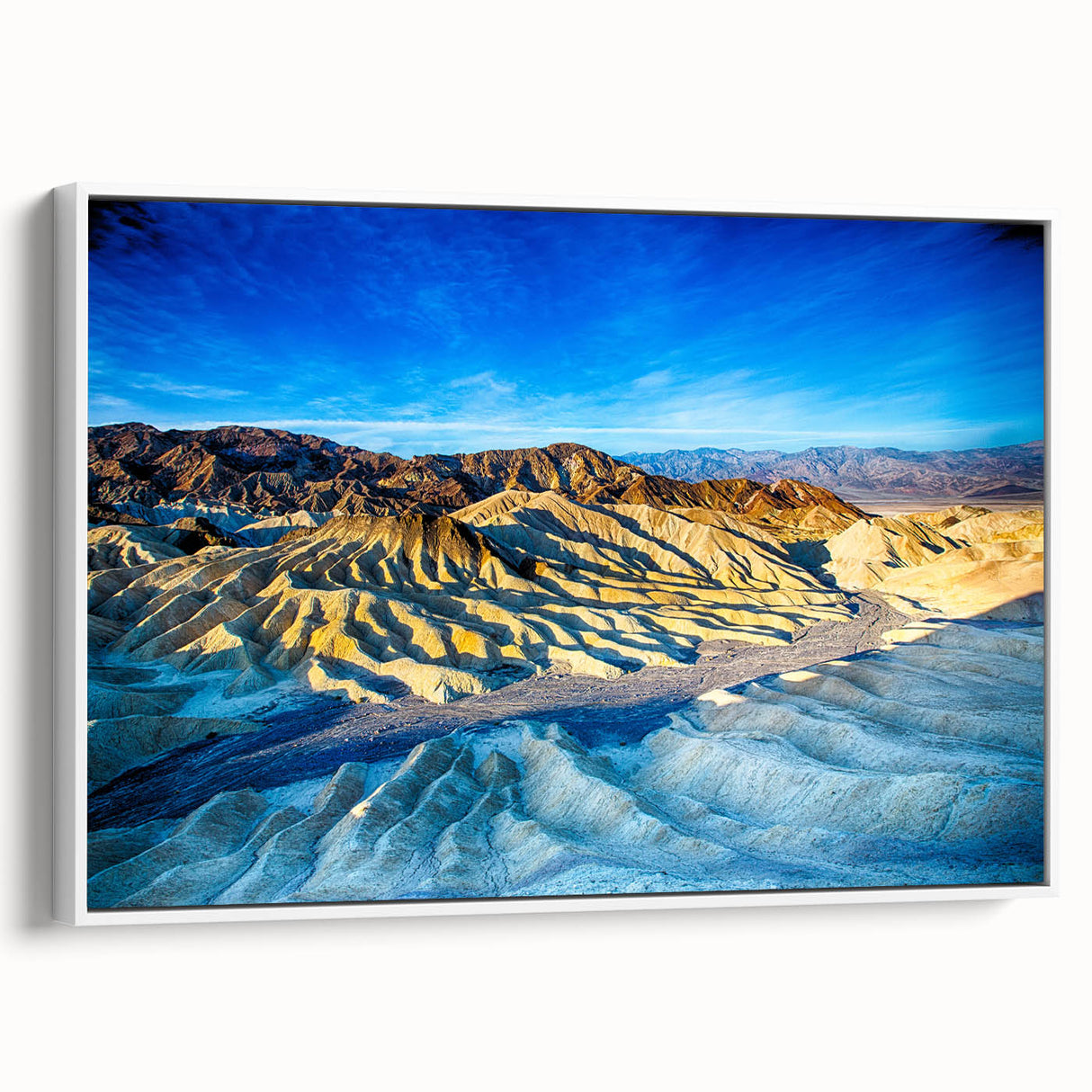 Vintage poster art of Death Valley with vibrant earth tones on a large framed canvas, ideal for living room decor.