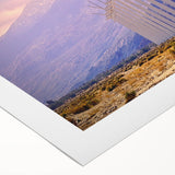 Art deco poster of Palm Springs with vintage cars and palm trees in pastel colors on rolled canvas.