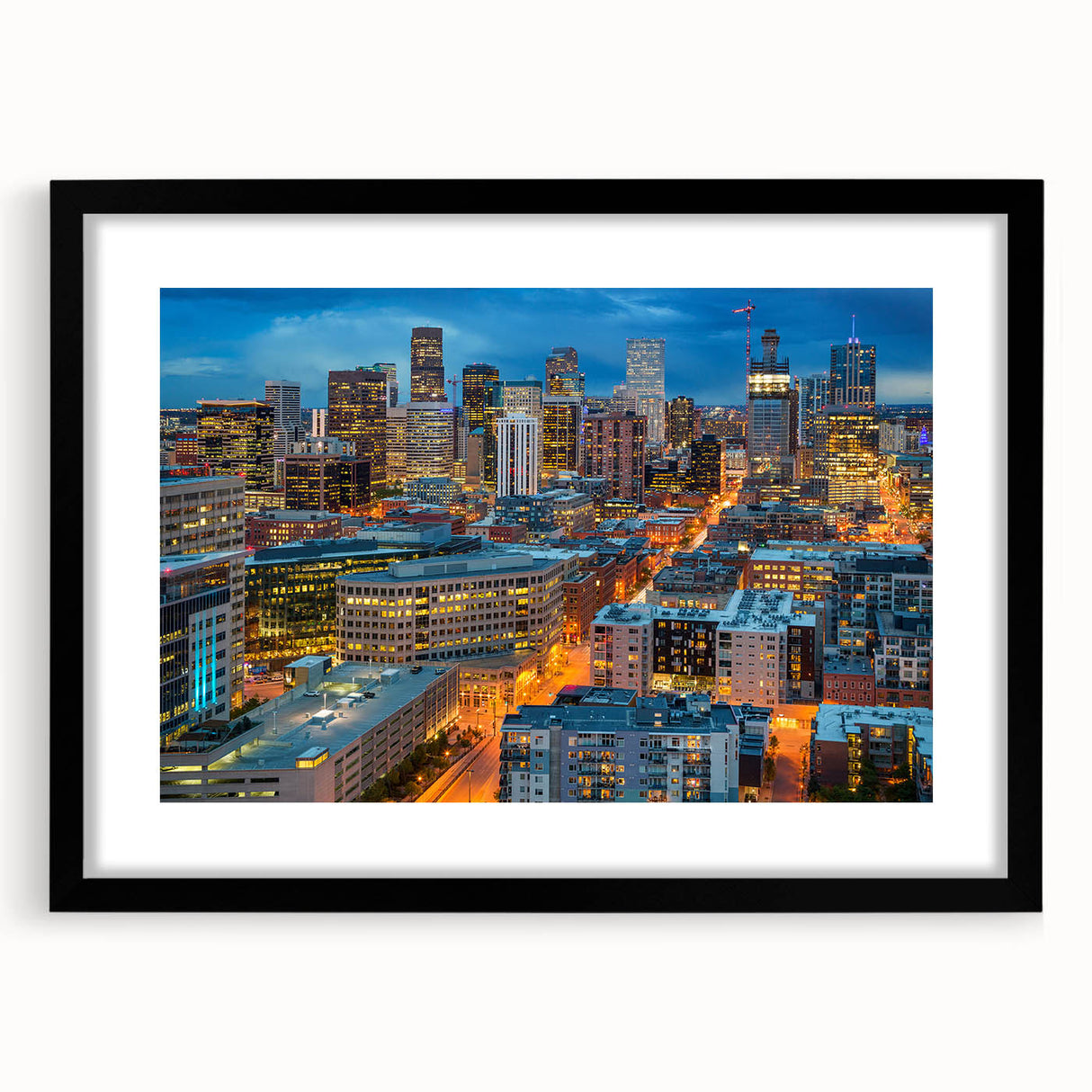 Colorful abstract art print of Denver skyline in vibrant hues on a large framed canvas, ideal for living room decor.
