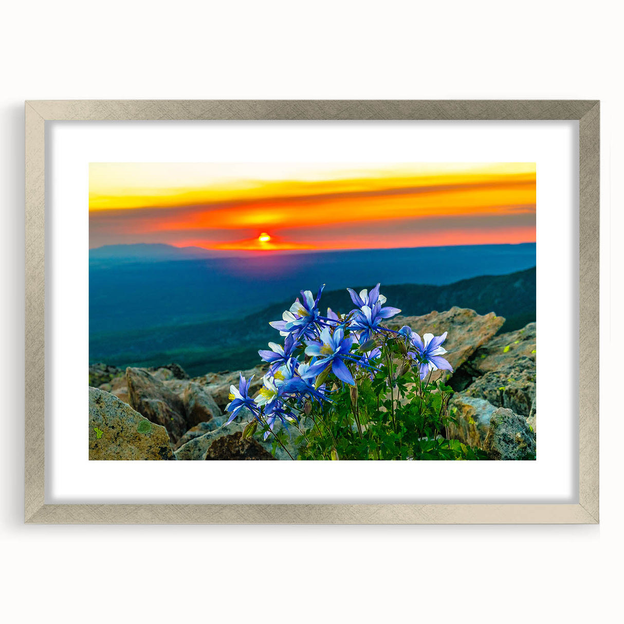 Textured abstract art print depicting Colorado Springs in muted earth tones, framed in silver, suitable for bedroom decor.