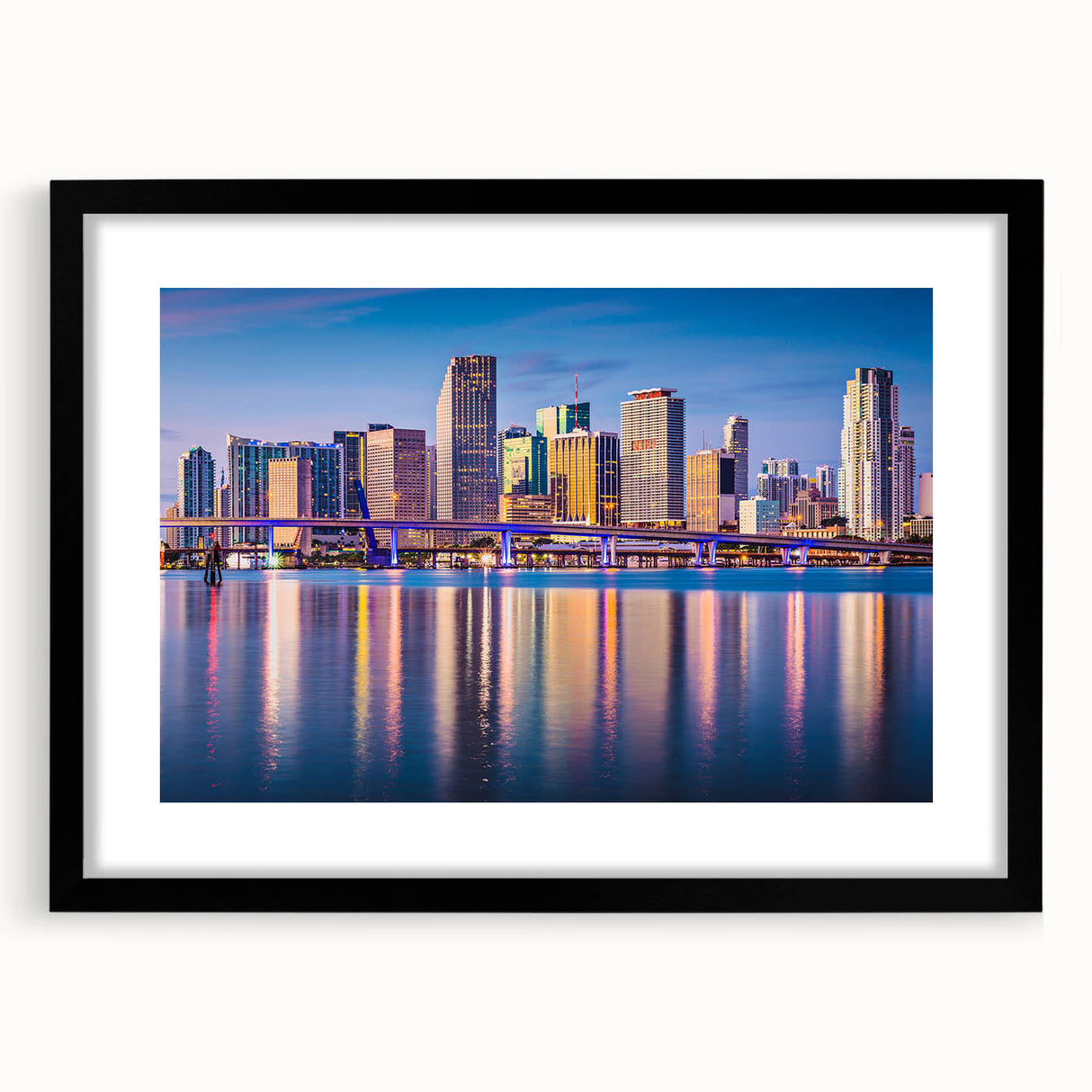 Abstract art print of Miami skyline in vibrant colors on a large framed canvas, suitable for living room decor.