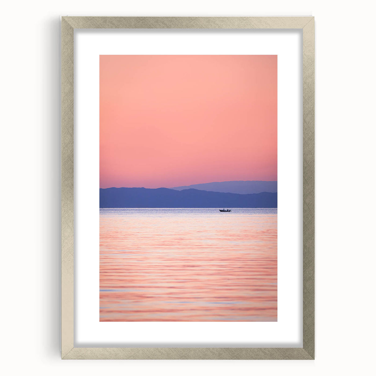 Textured abstract art print of Lake Michigan, featuring muted blue and gray tones on a framed silver mat.