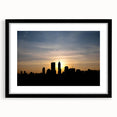 Abstract art print of Indianapolis skyline in vibrant colors on a large, framed canvas, ideal for living room decor.