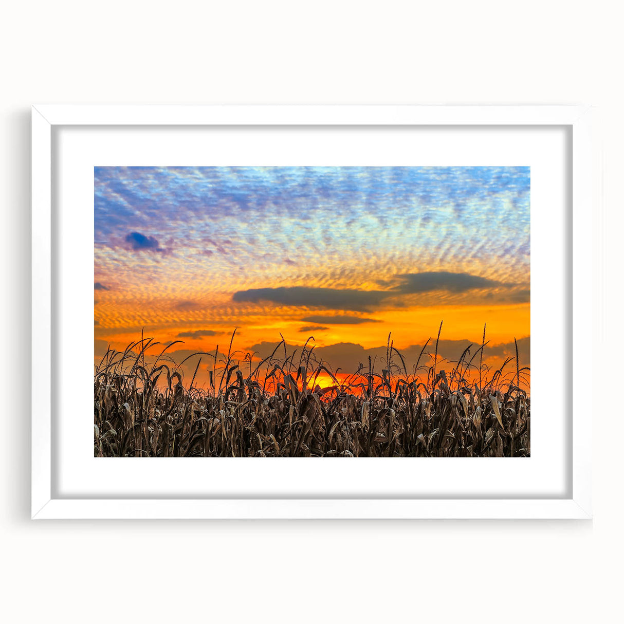 Abstract art print of Indiana scenery in muted earth tones, framed with a white mat, suitable for dining room decor.