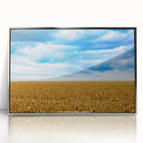 Mid-century modernist art depicting Iowa scenery in muted earth tones on a silver-framed acrylic print.