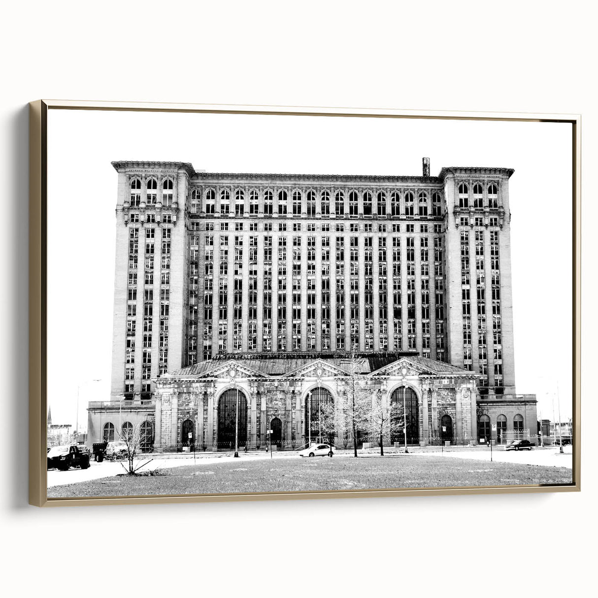 Framed canvas depicting a vintage-style Detroit landscape in black and gold tones, ideal for bedroom decor.