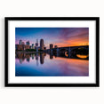 Extra large abstract art print of Minneapolis skyline in colorful, textured hues on a black framed canvas.