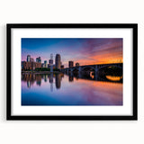 Extra large abstract art print of Minneapolis skyline in colorful, textured hues on a black framed canvas.