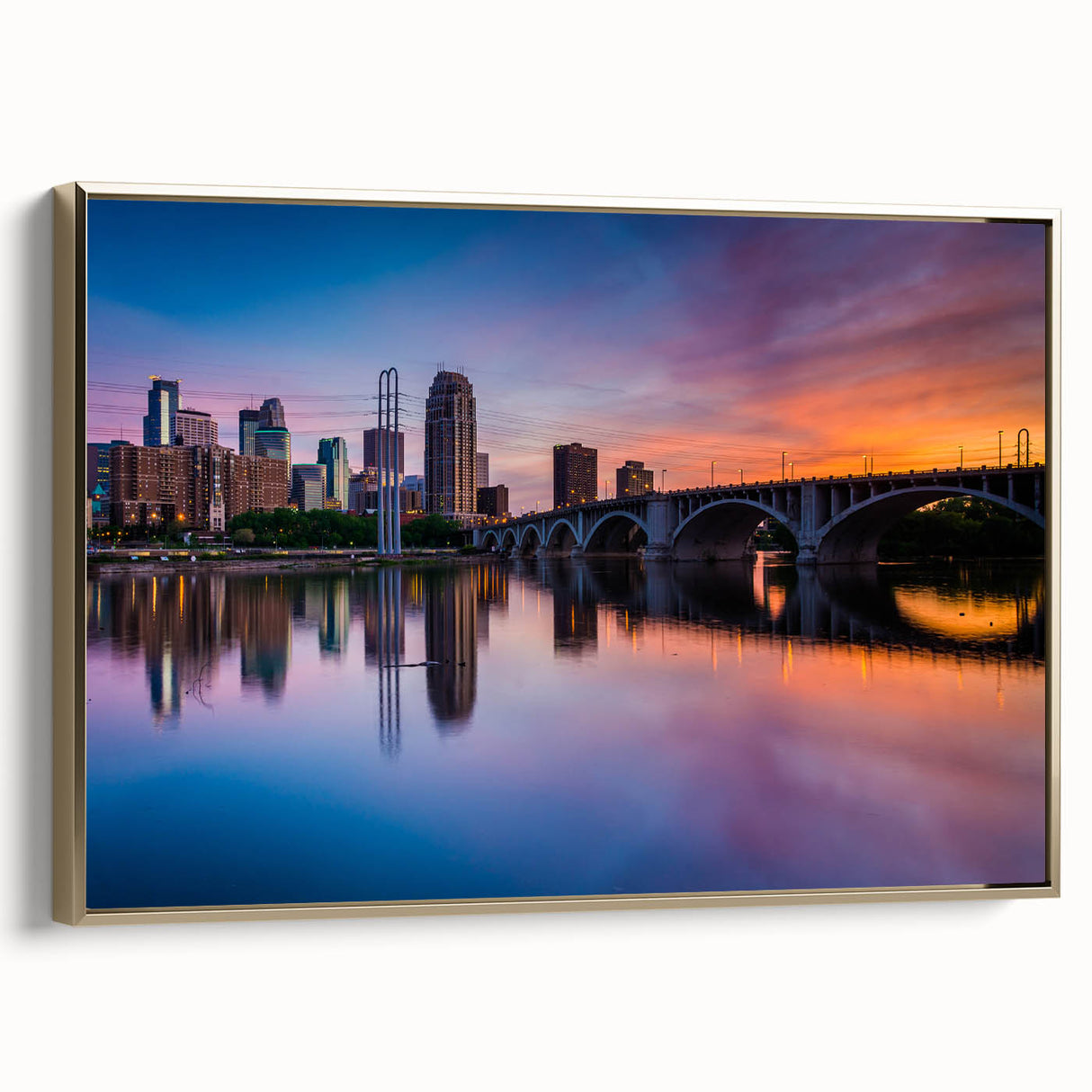 Framed canvas of Minneapolis landscape in vintage poster style with black and gold tones, ideal for bedroom wall art.