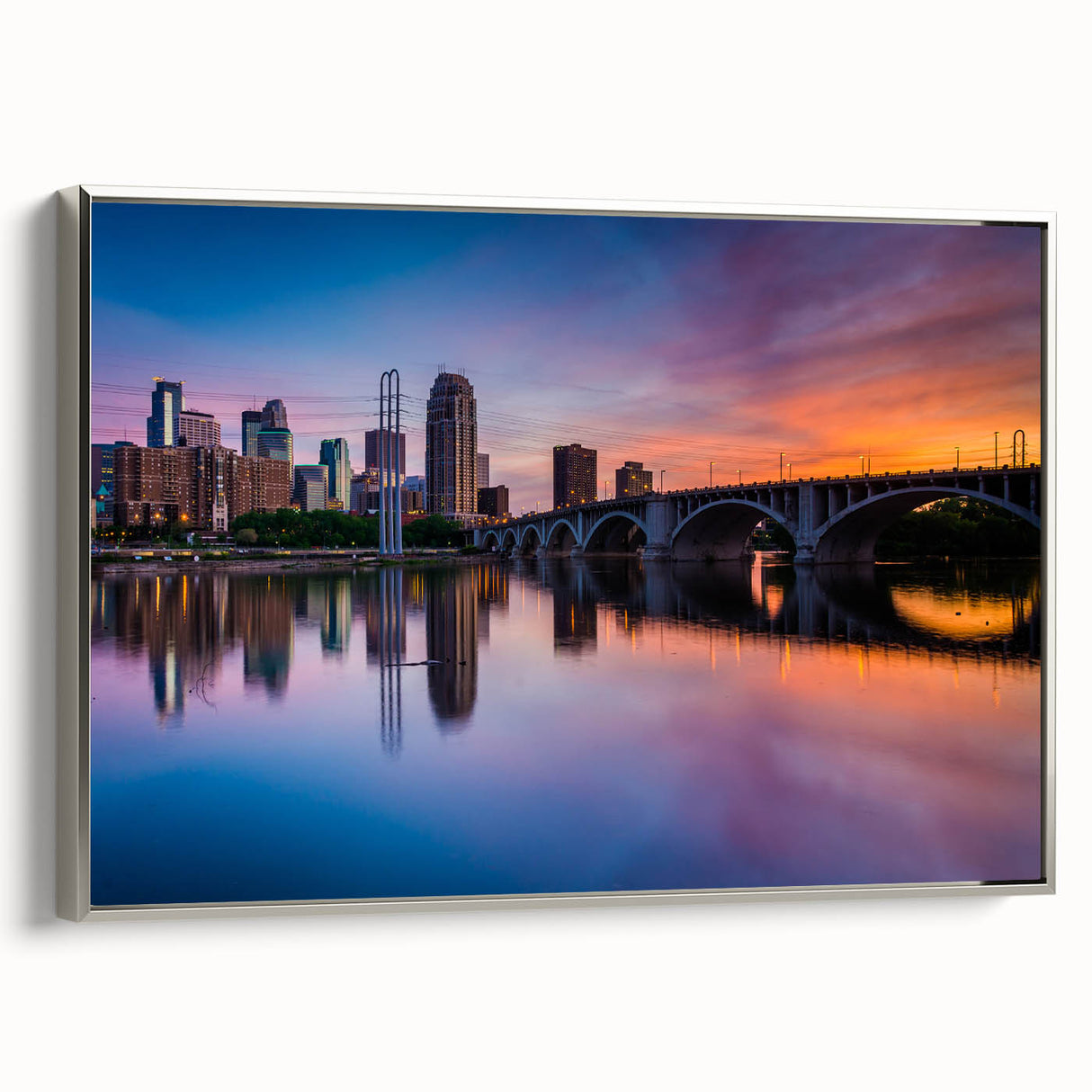 Framed canvas landscape art painting of Minneapolis with vibrant colors on a black background.