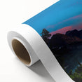 Art deco poster of Glacier National Park on rolled canvas, featuring cool blue and green tones.