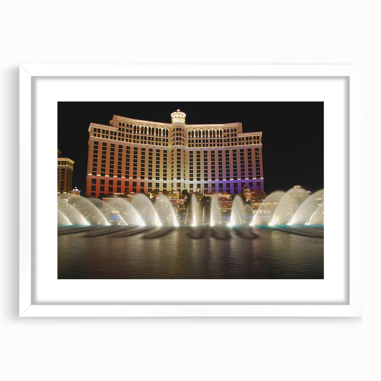 Abstract art print of Las Vegas skyline in muted gray and blue tones on a white framed canvas.