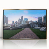 Acrylic print of Charlotte, North Carolina skyline in muted gold tones on a framed large art print.