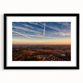 Abstract art print of colorful, textured scenery, displayed in a black frame with mat, ideal for living room decor.