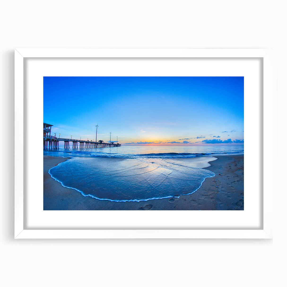 Abstract art print of North Carolina's Outer Banks in muted blue tones, framed with a white mat.