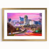 Extra large abstract art print of Raleigh skyline in muted earth tones on a textured canvas, ideal for living room decor.