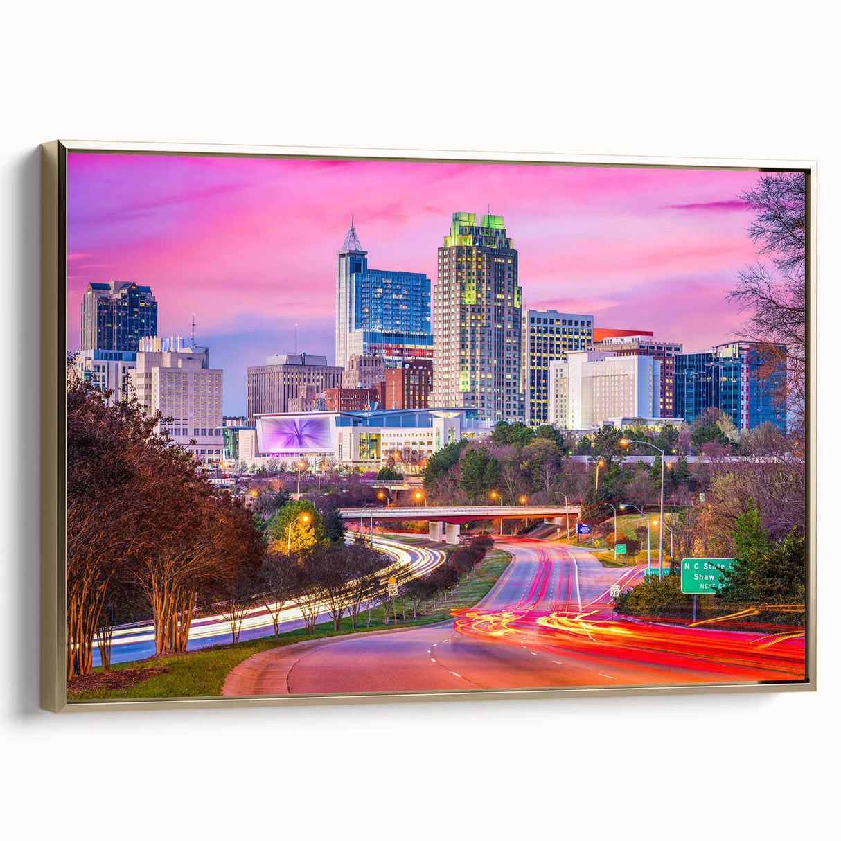 Framed canvas of a vintage-style Raleigh landscape in muted gold and black tones, ideal for bedroom wall art.