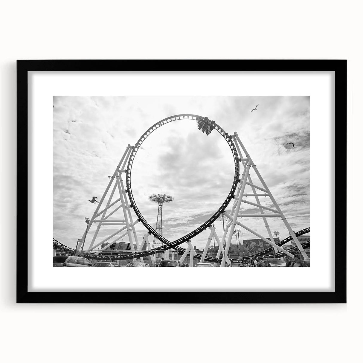 Abstract art print of Coney Island in vibrant colors, textured on a large black-framed canvas, ideal for living room decor.