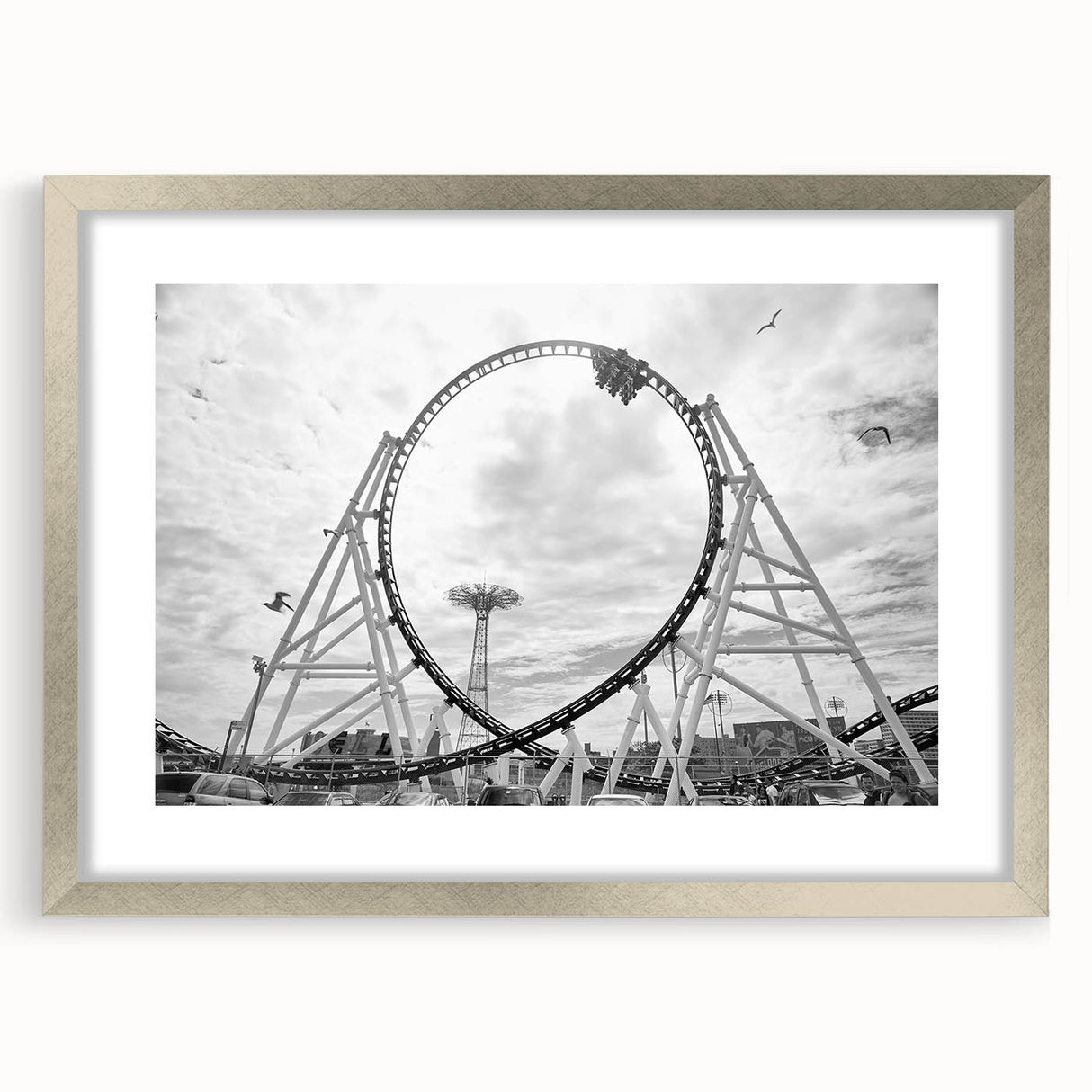 Textured art print depicting an abstract Coney Island scene in muted blue and gray tones on a framed silver mat.