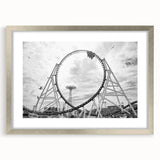 Textured art print depicting an abstract Coney Island scene in muted blue and gray tones on a framed silver mat.