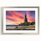 Textured art print of Ellis Island in abstract style, featuring muted blue and gray tones on a framed silver mat.