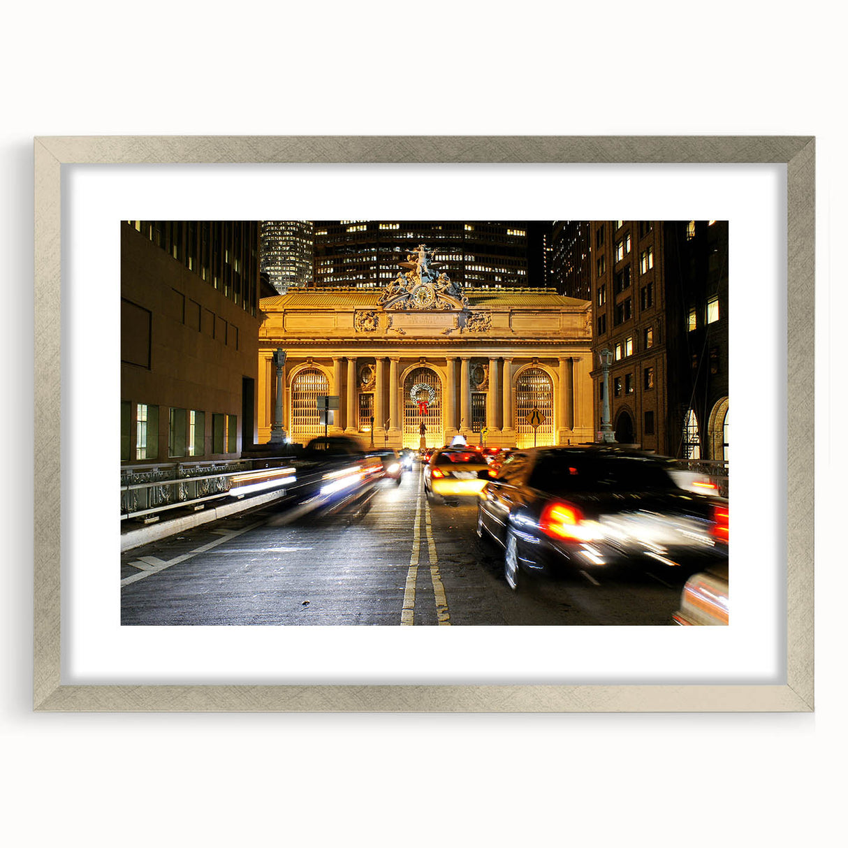 Textured abstract art print of NYC Grand Central in muted gray, framed in silver, ideal for bedroom decor.