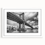Abstract art print of the Manhattan Bridge in muted gray and blue tones, framed with a white mat.
