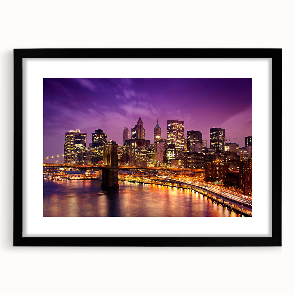 Extra large abstract art print of Manhattan skyline in vibrant colors on a textured canvas, framed in black.