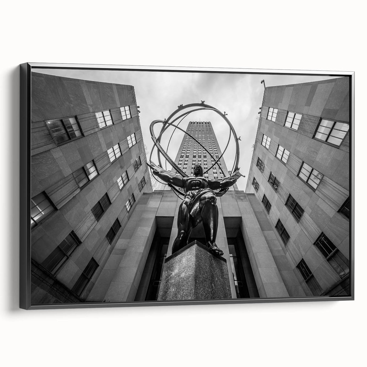 Black and white wall art featuring a vintage poster art style view of Rockefeller Center on a framed canvas.