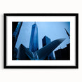Abstract art print of NYC skyline in vibrant colors on a large framed canvas, ideal for living room decor.