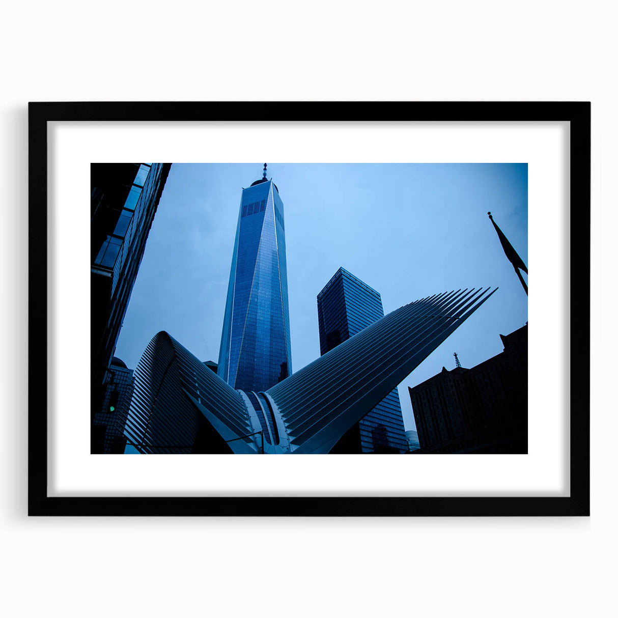 Abstract art print of NYC skyline in vibrant colors on a large framed canvas, ideal for living room decor.