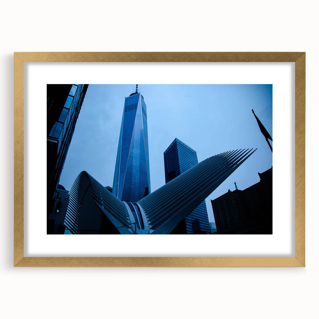 Extra large abstract art print of NYC skyline in muted gray and gold tones on a textured canvas, framed in gold.