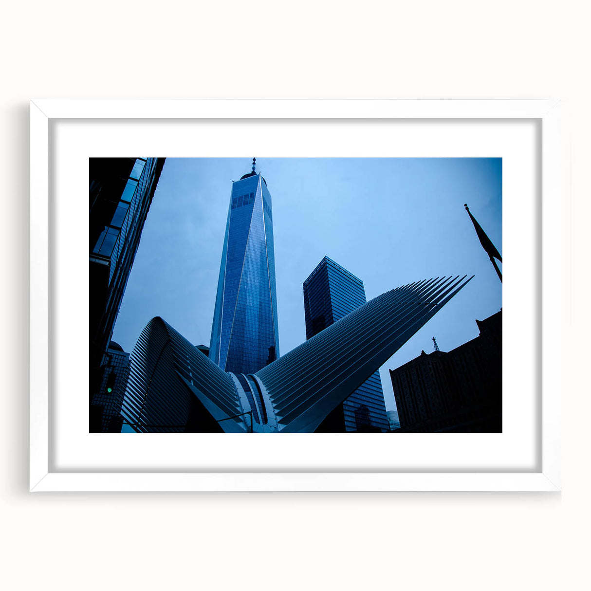 Abstract art print of New York City's skyline in muted gray tones on a framed white mat, ideal for dining room decor.