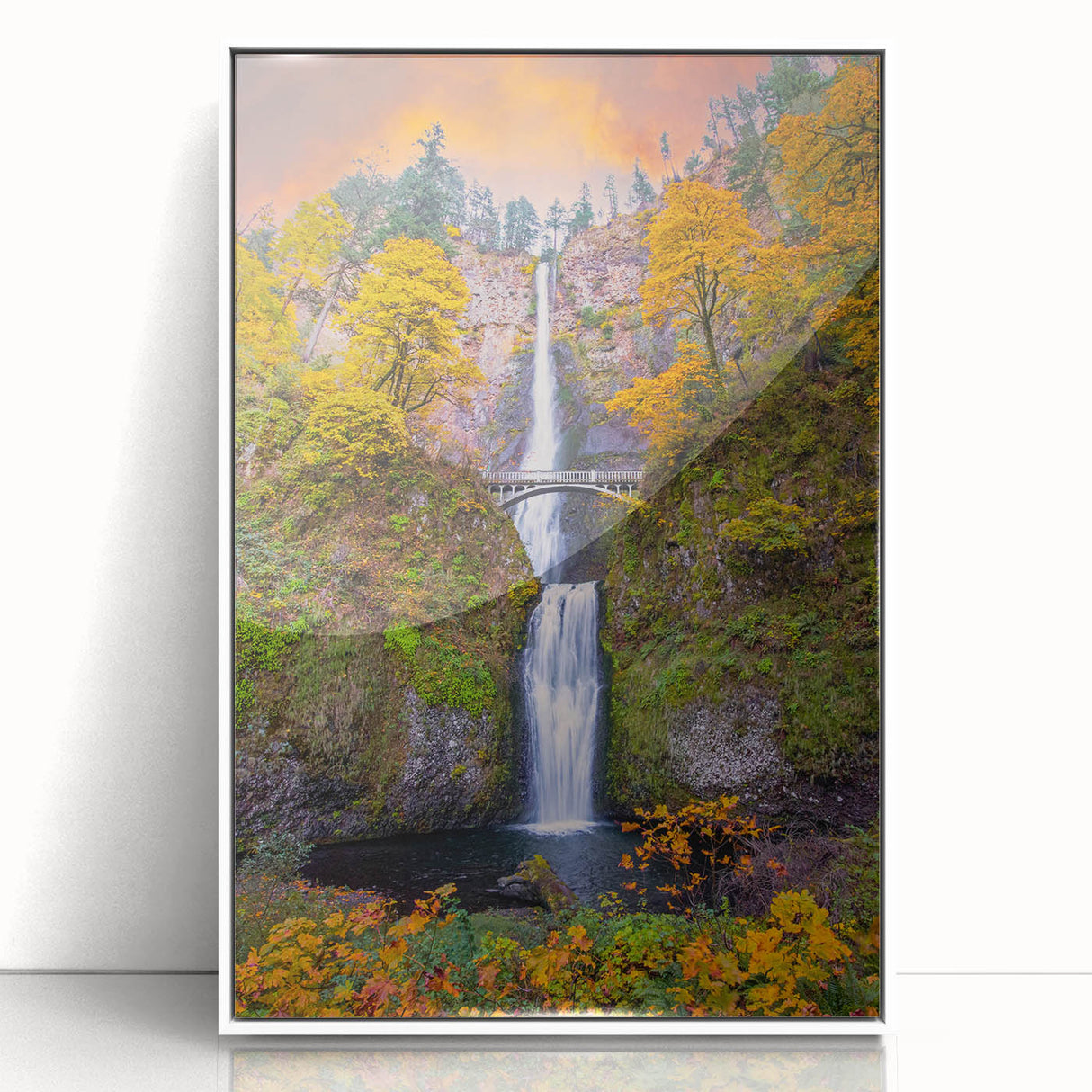 Acrylic print of Multnomah Falls in Oregon with lush greenery, framed in white, ideal for modern art wall decor.