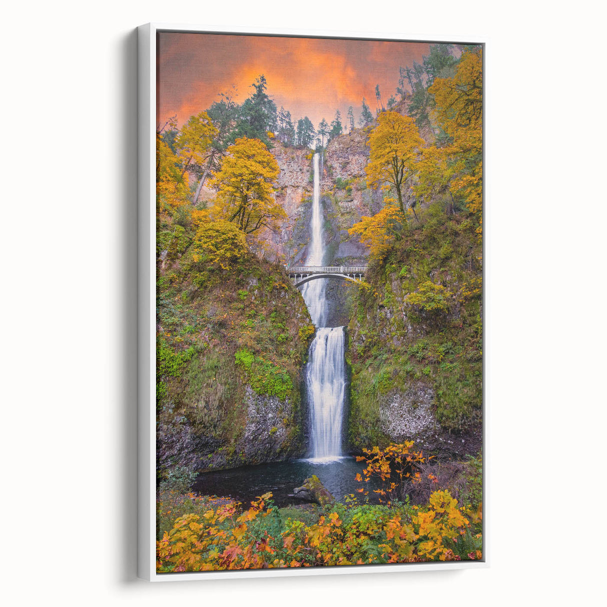 Vintage poster art of Multnomah Falls in Oregon, featuring vibrant green and blue tones on a framed canvas.