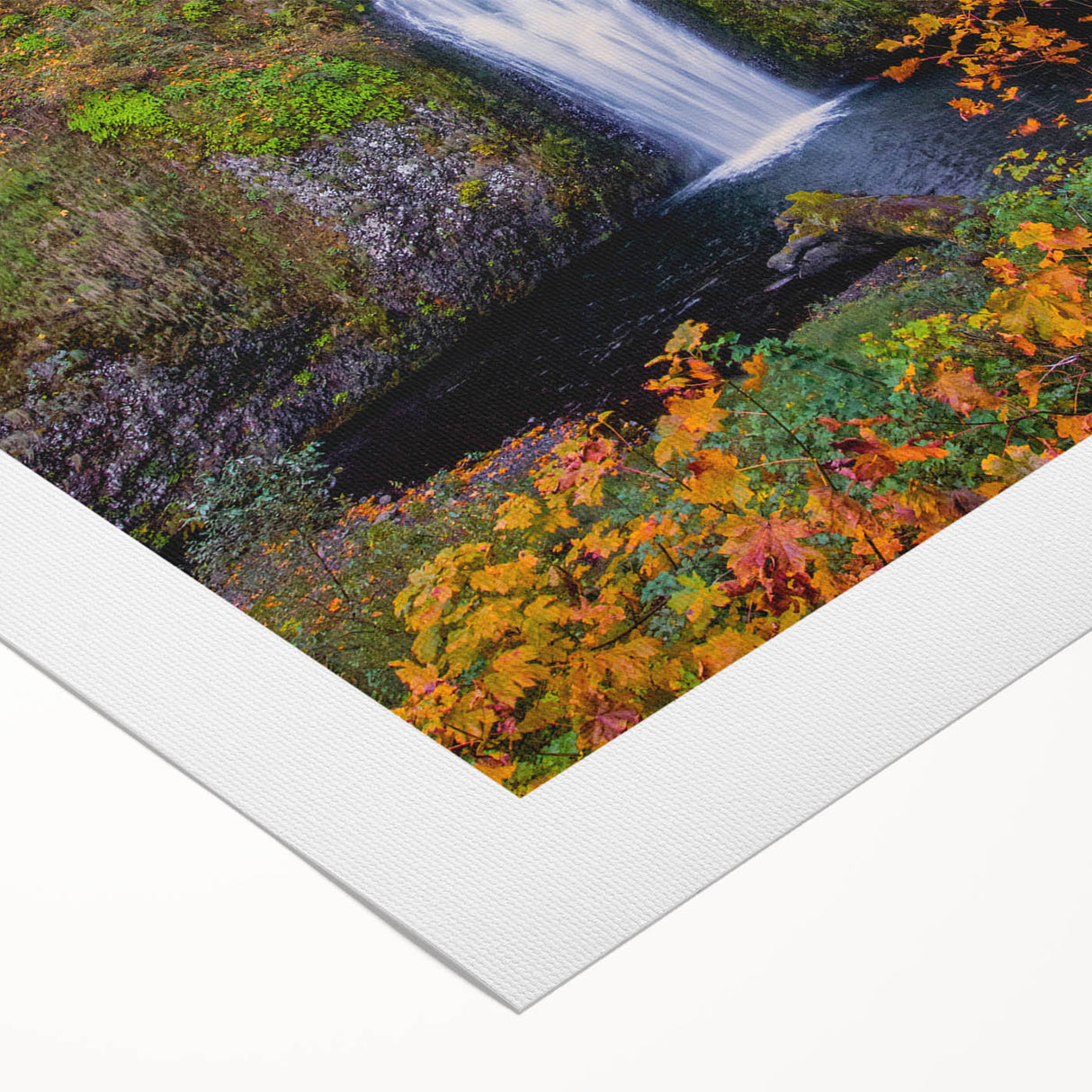 Art deco poster of Multnomah Falls in Oregon, featuring vibrant green and blue tones on rolled canvas.