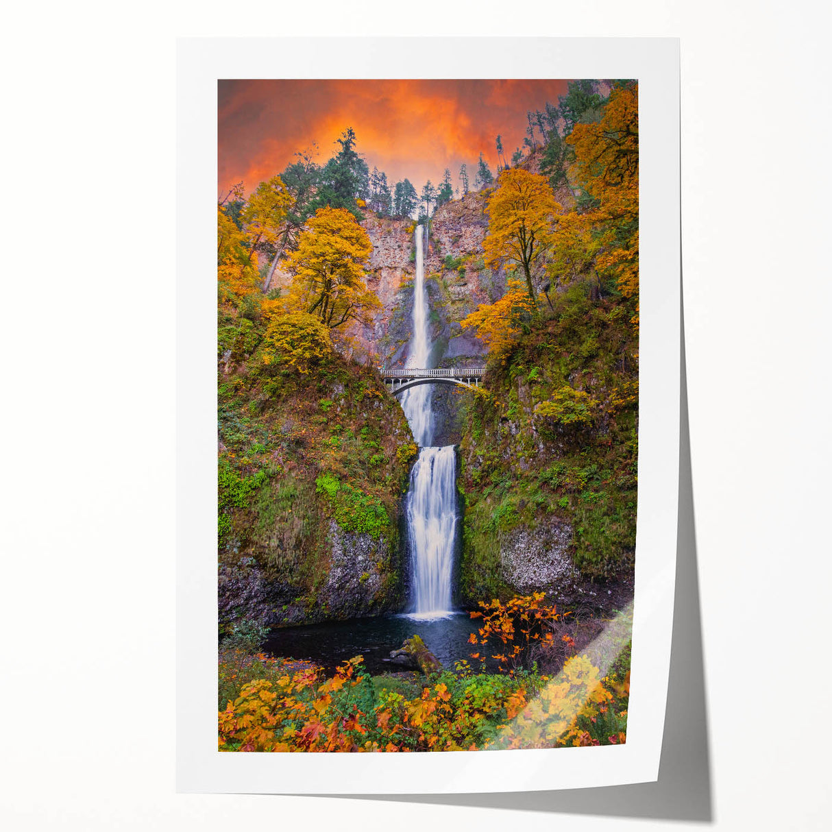 Extra large wall art of Multnomah Falls in Oregon, depicted in vibrant green and blue tones on a rolled canvas.
