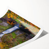 Extra large wall art of Multnomah Falls in Oregon, depicted in vibrant green and blue tones on a rolled canvas.