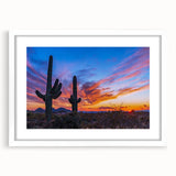 Abstract art print of Phoenix valley in muted orange and blue tones on a framed white mat.