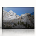 Acrylic print of Mt. Rushmore with muted earth tones in a black frame, suitable for modern art wall decor.