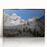 Acrylic print of Mt. Rushmore with a gold frame, featuring muted earth tones, ideal for modern art wall decor.