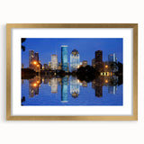 Extra large abstract art print of Houston skyline in muted gray and gold tones on a framed canvas.