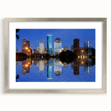 Textured abstract art print of Houston skyline in muted gray tones on a silver-framed mat, ideal for bedroom art.
