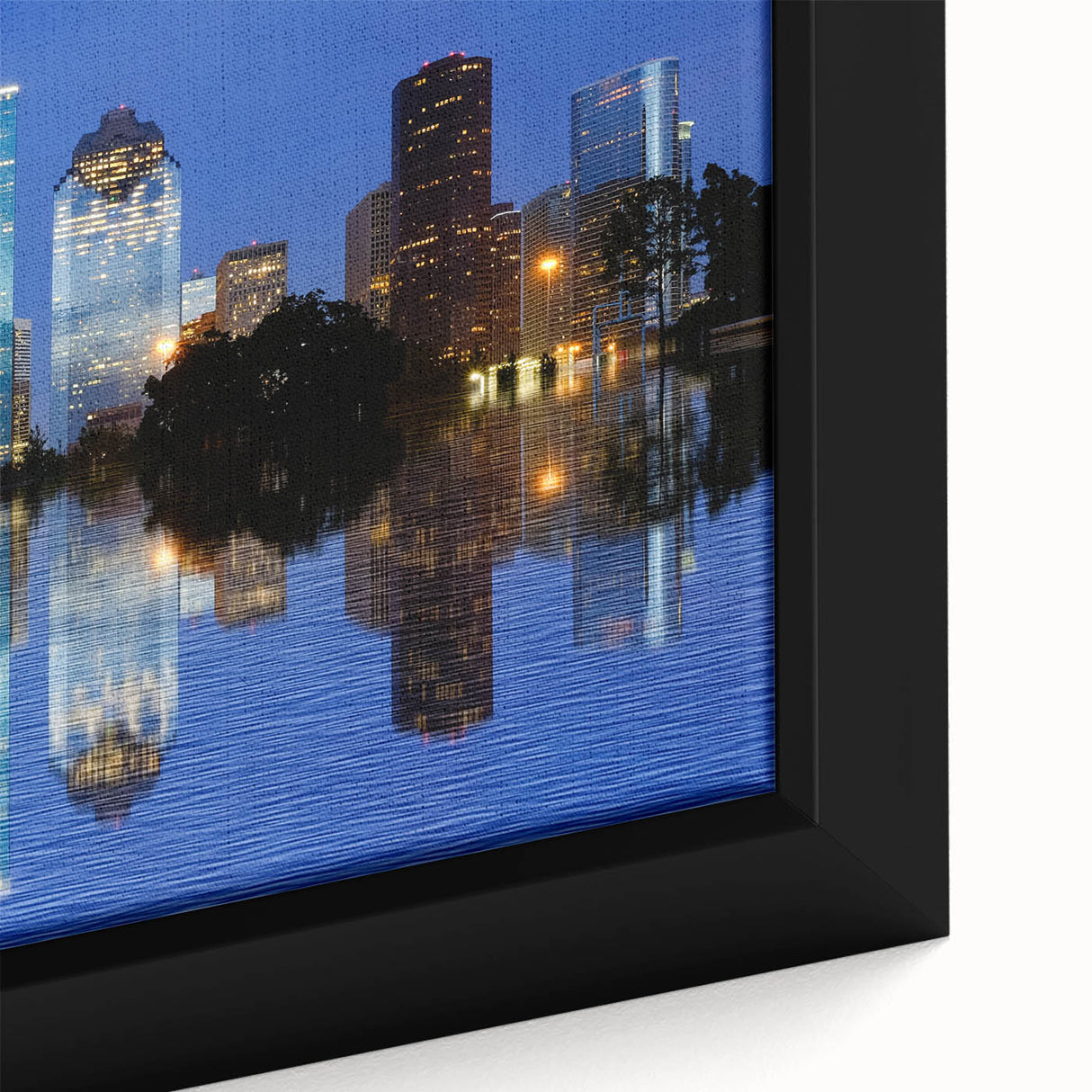 Close-up of a black wall art featuring a textured Houston skyline in vibrant colors on a framed canvas.