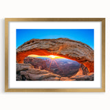 Extra large wall art featuring a textured abstract print of Utah's Arches in muted earth tones, framed in gold.